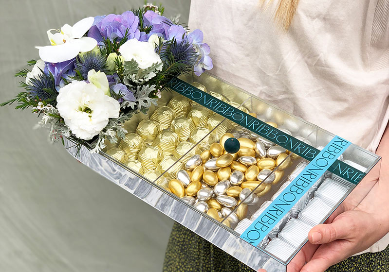 Holiday Chocolates And Flowers As A Gift